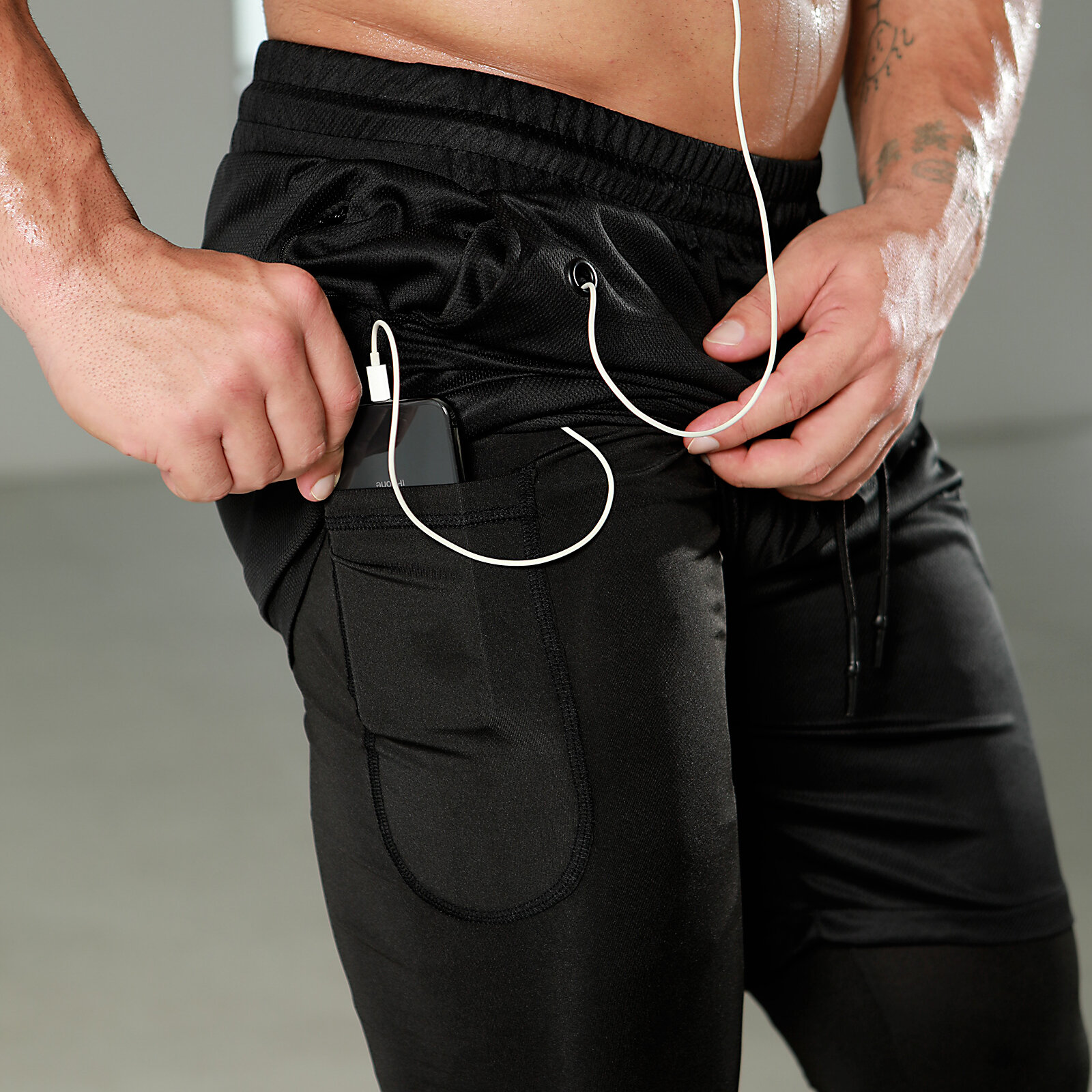 2 in 1 Men's black tight stretch legging and gym shorts - towel loop,Drawstring closure,Elastic Waist band, Headphone Jack,zipper pocket.